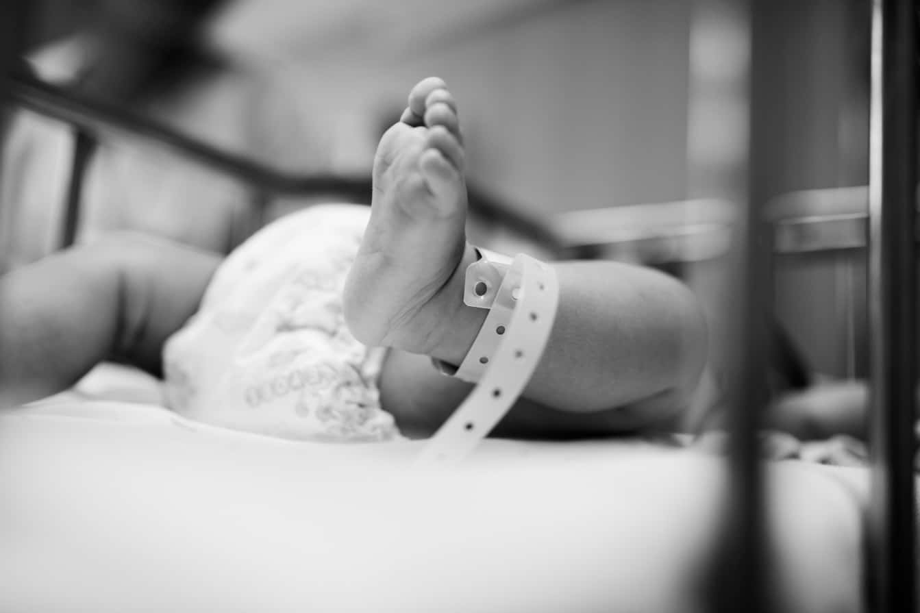 Baby with hospital band around ankle